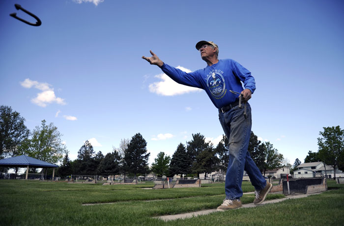 Larry Getts practices his horseshoe tossing out at Eastgate Park on Monday, April 28, 2014. Getts is a part of the Columbia Basin Horseshoe Club that has league play every Tuesday throughout the summer.