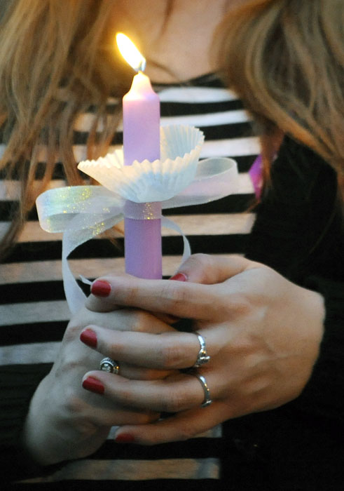 A candlelight vigil was held for Monique Williams, 29, at the John Dam Plaza in Richland on Friday evening. Williams was killed in her home by her ex-boyfriend Aaron Newport on Monday in what officials are calling a murder-suicide.