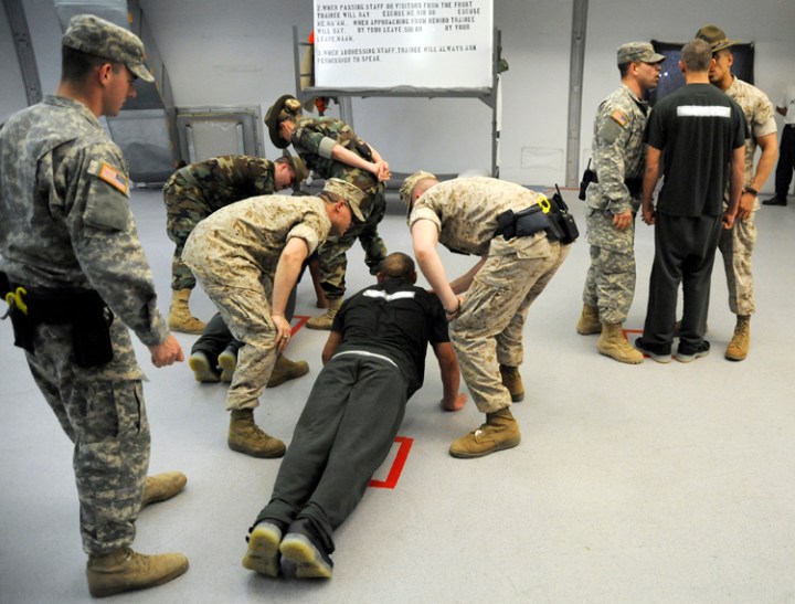 The drill instructors get into the faces of the newest cadets, Platoon 2-14, during the induction at Camp Outlook in Connell as part of their Juvenile Offender Basic Training Camp.