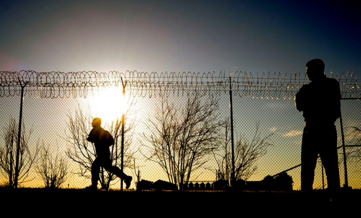 PFC. Kyle Dallas watches as a recruit  runs around the camp during physical fitness training on Thursday morning at Camp Outlook in Connell as part of their Juvenile Offender Basic Training Camp.
