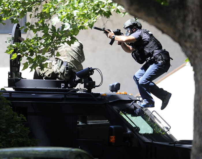 Members of the Tri-City Regional SWAT Team responded to an apartment where a man barricaded himself inside his apartment at West 21st Avenue and South Rainier Street in Kennewick after he pointed a gun at a woman early on Friday morning. The man has been arrested and taken into custody.