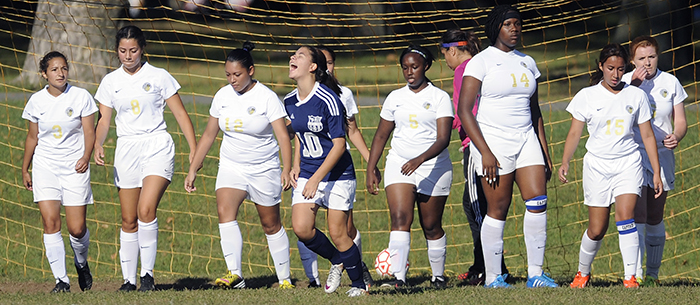 Union City's Rachel Malkowski screams in celebration after scoring a goal over the top of a line of Hudson Catholic defenders on a free kick during a game at Lincoln Park in Jersey City on Wednesday, Sept. 17, 2014. Matt Gade | The Jersey Journal