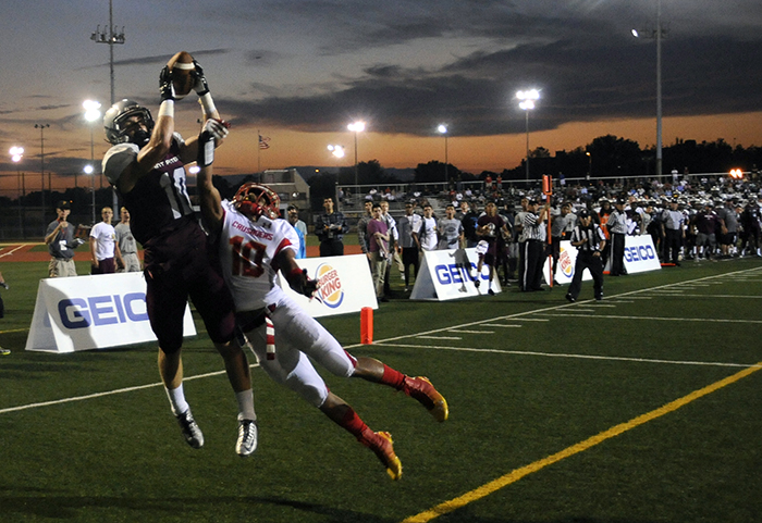 St. Peter's Prep Kolton Huber (10) grabs a touchdown pass past the defense of Bergen Catholic's Ryan McCarthy during the first half of a game on Thursday, Sept. 11, 2014. Matt Gade | The Jersey Journal