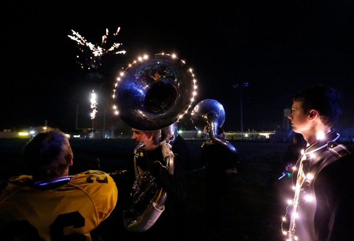 Members of the Mitchell High School band perform under darkness using a variety of glow in the dark light accessories and concluding with fireworks as part of the Lights Out performance following MHS' football game against Sioux Falls Roosevelt on Friday night at Joe Quintal Field in Mitchell. (Matt Gade/Republic)