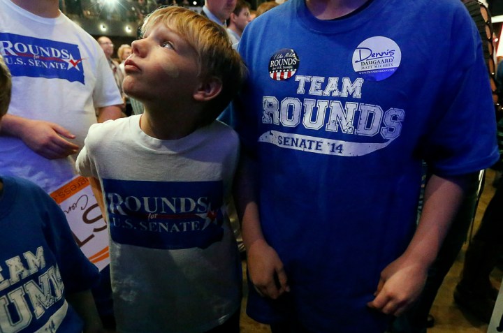 Zayden Rounds looks off at the screen during the Republican Election Party on Tuesday night at The District restaurant in Sioux Falls. (Matt Gade/Republic)