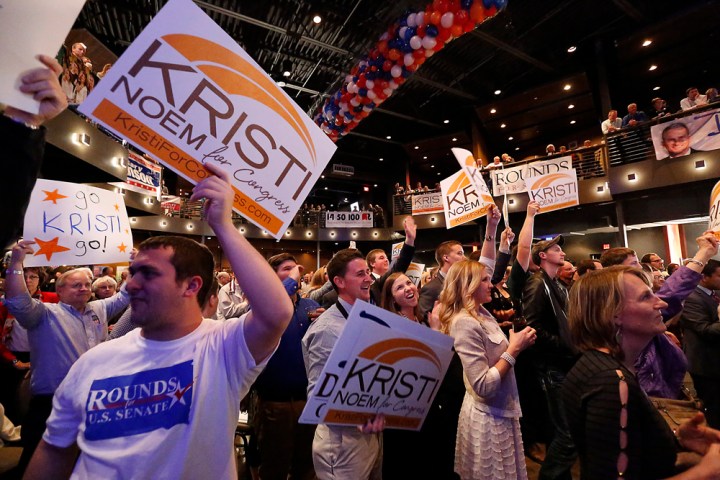 Supporters hold up Kristi Noem signs during the Republican Election Party on Tuesday night at The District restaurant in Sioux Falls. (Matt Gade/Republic)