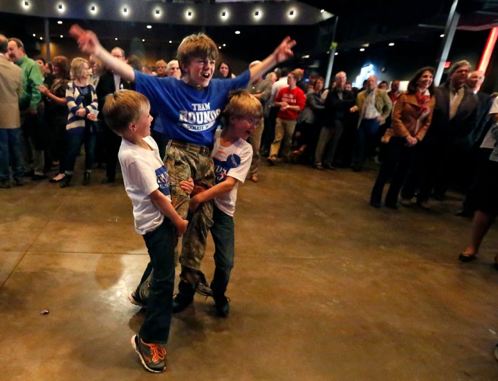 Donald Rounds is hoisted up by Zayden Rounds and Williams rounds during the Republican Election Party on Tuesday night at The District restaurant in Sioux Falls. (Matt Gade/Republic)