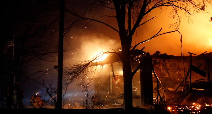 Firefighters with the Mitchell Fire Department, with assistance from Ethan, Mount Vernon, Alexandria and Rosedale battle a house fire early Sunday morning on Lakeview Lane in north Mitchell. (Matt Gade/Republic)