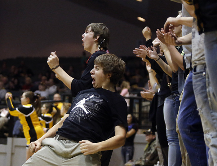 Mitchell High School juniors Myles Szabo, front, and Mitchell Price cheer on the Kernels during a game against Pierre on Friday night at the Corn Palace in Mitchell. (Matt Gade/Republic)
